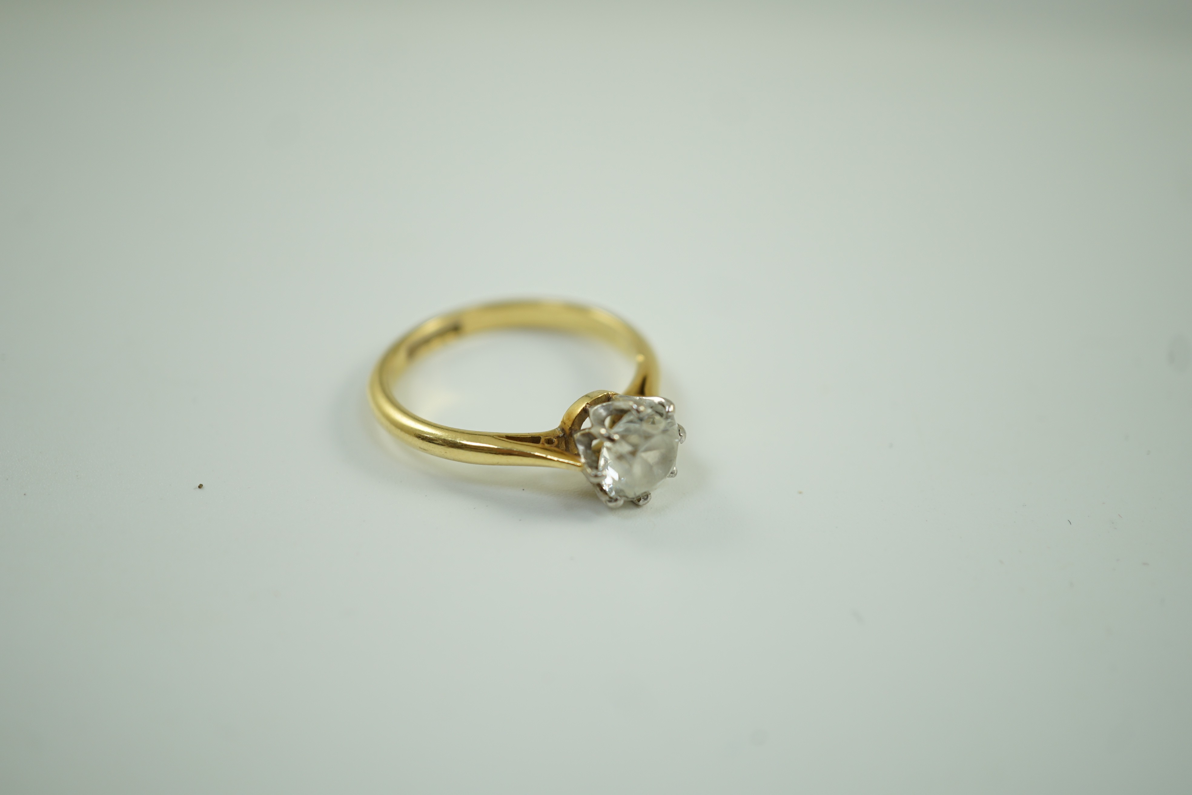 An 18ct, plat and single stone white zircon? set ring, size R, gross weight 4.8 grams.